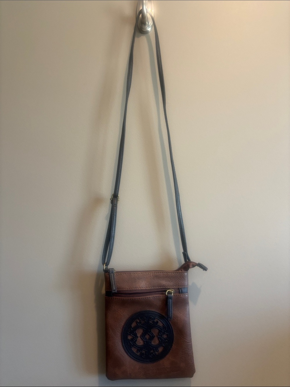 Brown Leather Crossbody Bag with Dark Brown Medallion Accent